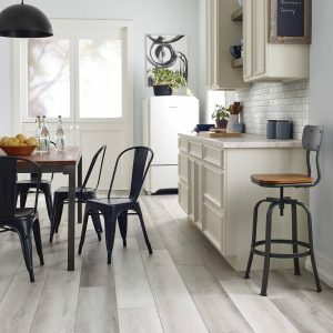 Farm house chateau modern oak wood floor in the kitchen with a dinning table