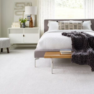 decorative model bedroom with white carpet bringing a bright comfortable design feel, in birmingham, alabama