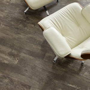 Detailed wood surface flooring in a room setting with a white office chair in birmingham, Al